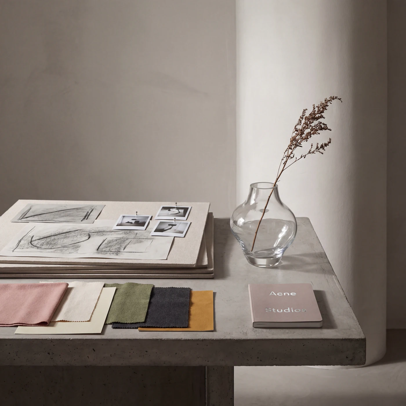 Fabric swatches and drawings laid out on a design table