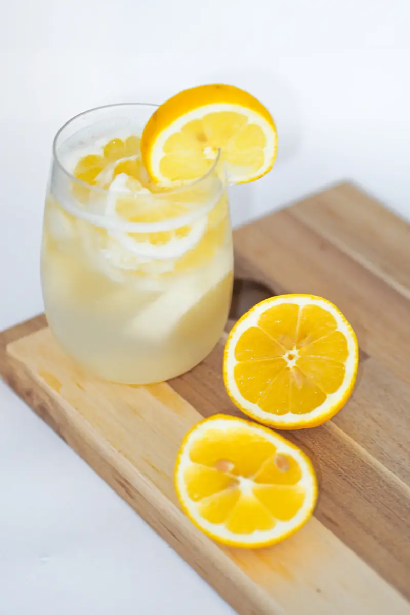 A glass of fresh lemonade with lemon slices